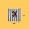 Pink-green letter 'X' Iron-on Embroidery