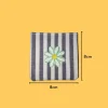 Green flower with yellow center Iron-on Embroidery