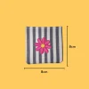 Neon pink flower with yellow center Iron-on Embroidery