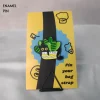 Black Cat in Striped Leaves Plant Enamel Pin