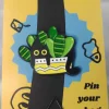 Black Cat in Striped Leaves Plant Enamel Pin